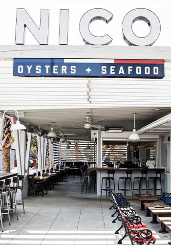 The counter and seating area of Nico Oyster + Seafood restaurant.