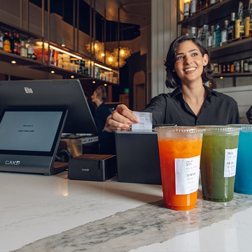 Server using CAKE POS with loyalty and email marketing tools to grow restaurant sales and repeat customers.