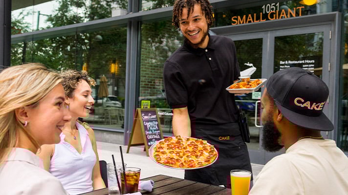 CAKE POS system helps staff efficiently serve customers in a pizza restaurant