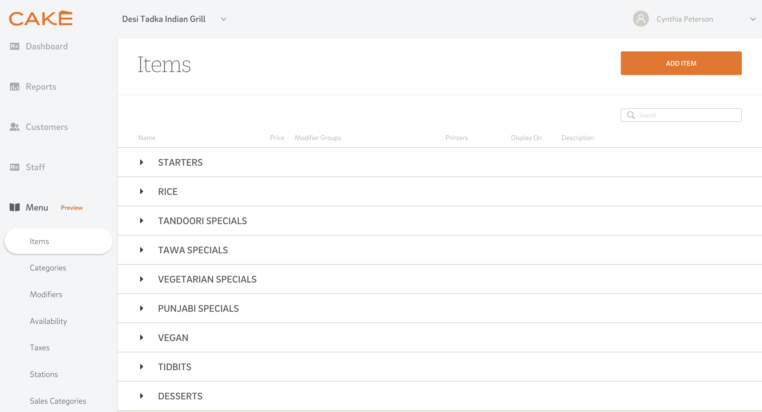 A screenshot of the CAKE POS admin portal, showing a customized menu for an Indian restaurant with categories like 