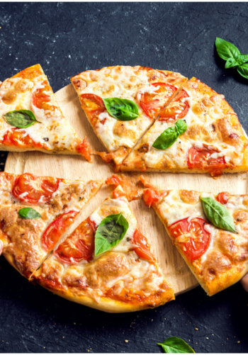 A round, half-and-half pizza showing different toppings on each side.