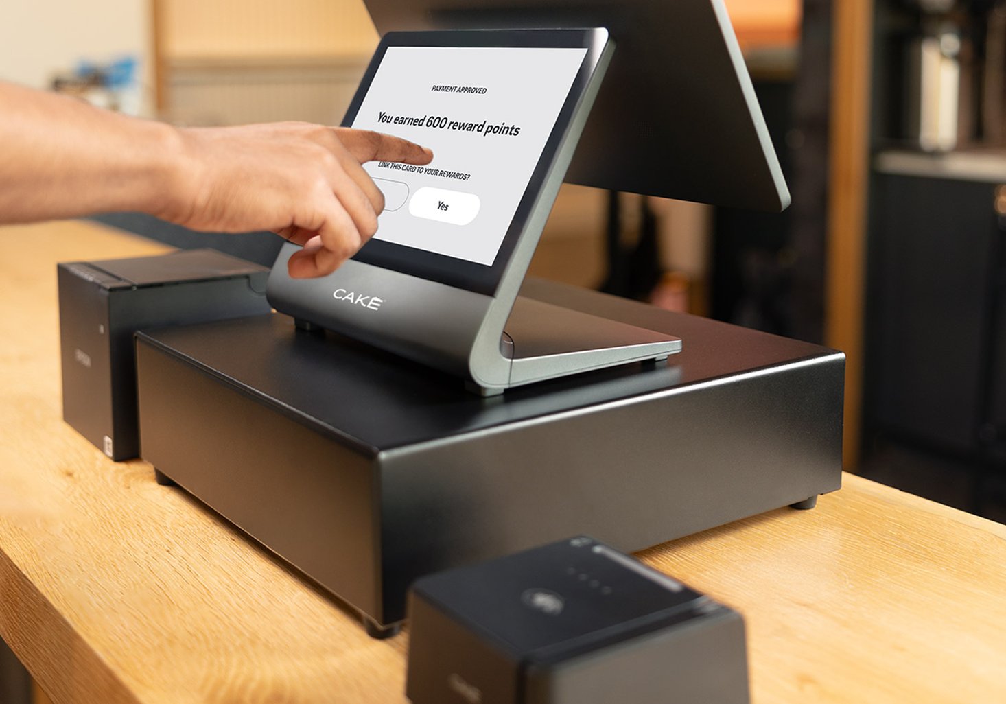 Guest earning rewards on CAKE POS with loyalty and email marketing tools for restaurant customer engagement.